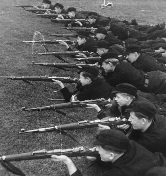 Boys in the Hitler Youth practice shooting at a firing range in 1943. The application of the 'Führer Principle' in schools and universities regimented the education system into a strict hierarchy. Educators chafed under the military discipline, worried that the schools would become just another part of the military training pipeline, funnelling children into the meat-grinder that had become the front by 1943. In the end, this is precisely what happened.